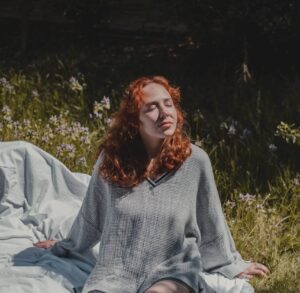 a women relaxing in nature