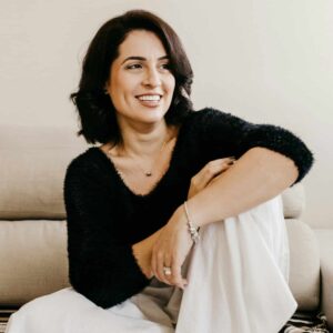 a woman reaching happiness and relaxing smiling